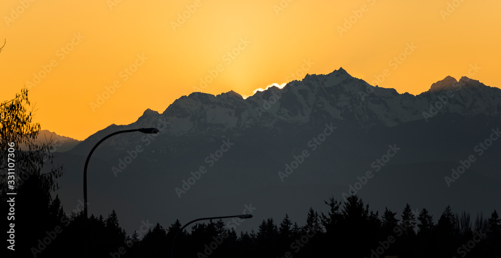 Sunset behind Olympic Mountains near Seattle Sunset behind Olympic Mountains near Seattle