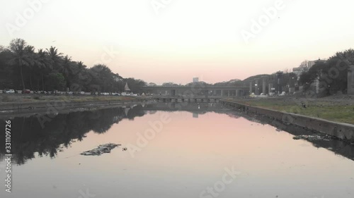 Drone shot still water reflection of a road bridge photo