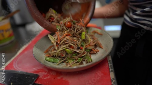 making thai papaya salad photo