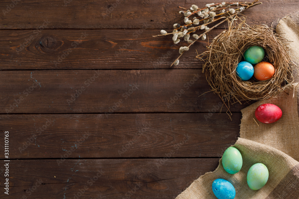 Still life many colorful easter eggs on a wooden background. Rustic. Decoration from natural fabrics and herbs. Easter celebration concept. Flat lay Still life many colorful easter eggs on a wooden background. Rustic. Decoration from natural fabrics and herbs. Easter celebration concept. Flat lay
