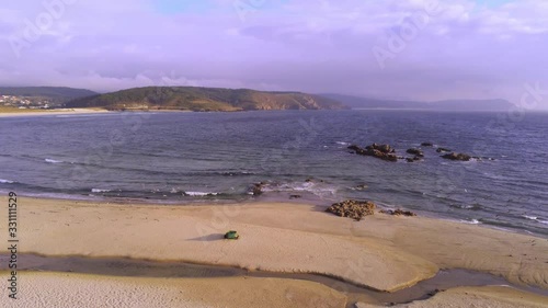 Aerial view in Beach of Galicia, Spain, on a sunny day. Drone footage photo