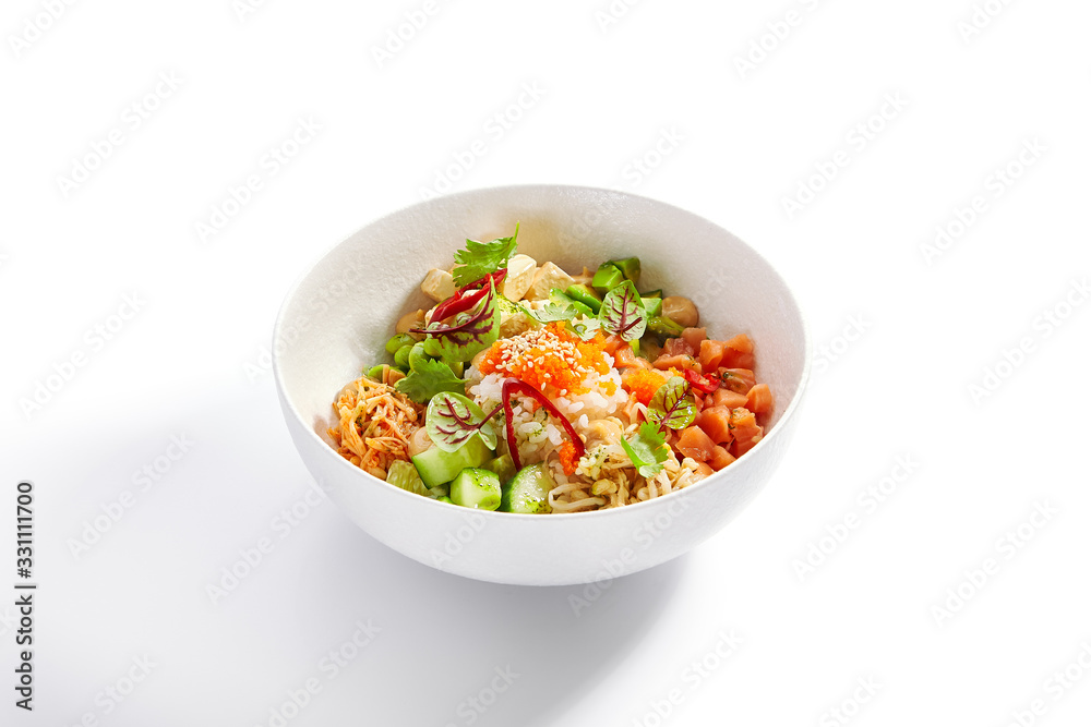 Poke with salmon, cut avocado and tofu side view Poke with salmon, cut avocado and tofu side view