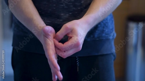 Young adult man crossing hands and get a dose of disinfectant for prevention. photo