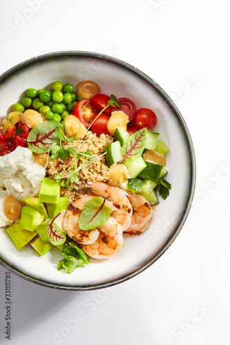 Bowl of couscous with shrimp and vegetables