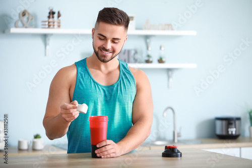 Sporty man making protein s...