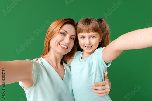 Woman and her little daught...
