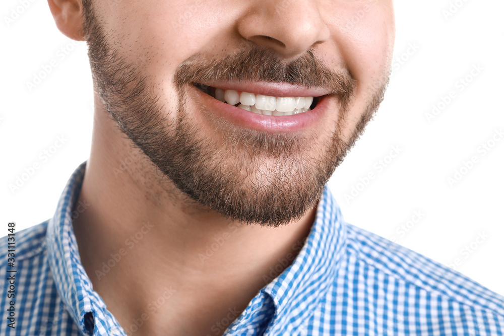 Handsome smiling young man on white background, closeup Handsome smiling young man on white background, closeup