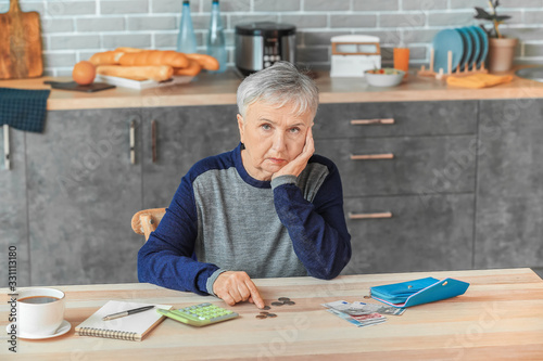 Senior woman counting money...