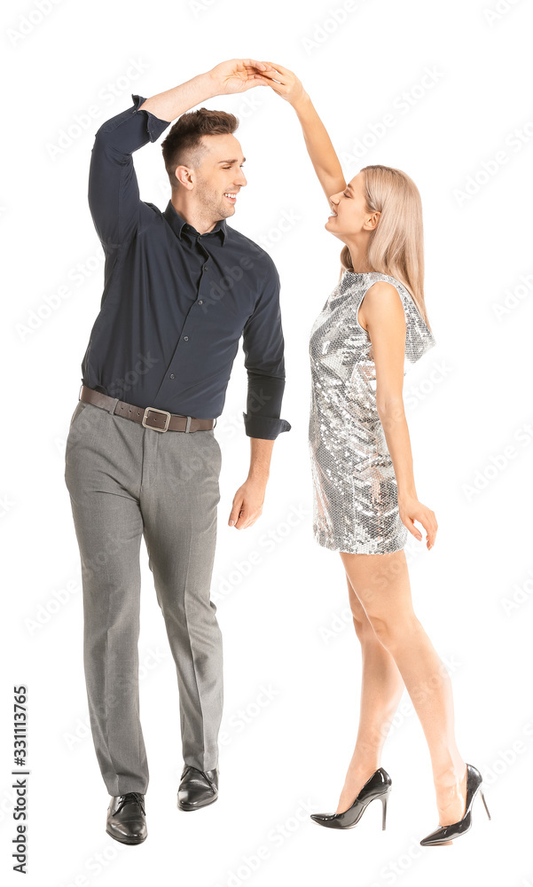 Happy dancing young couple on white background Happy dancing young couple on white background