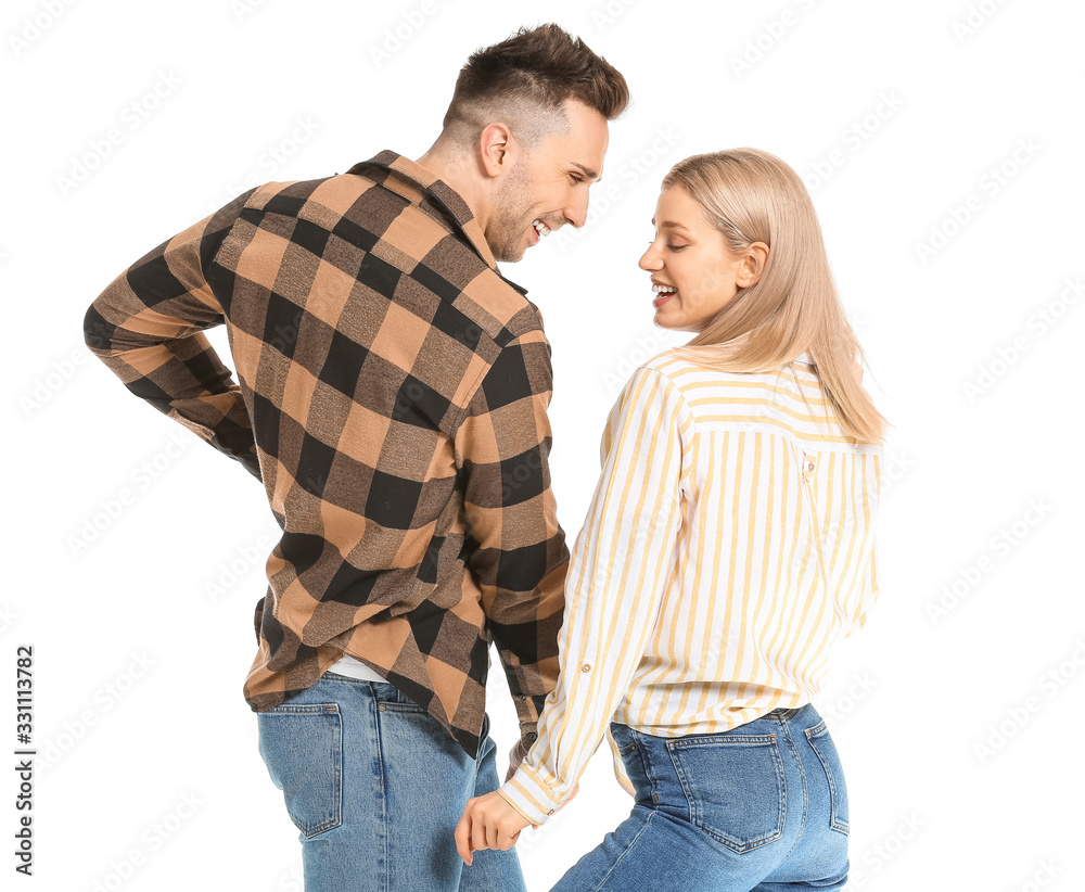 Happy dancing young couple on white background Happy dancing young couple on white background
