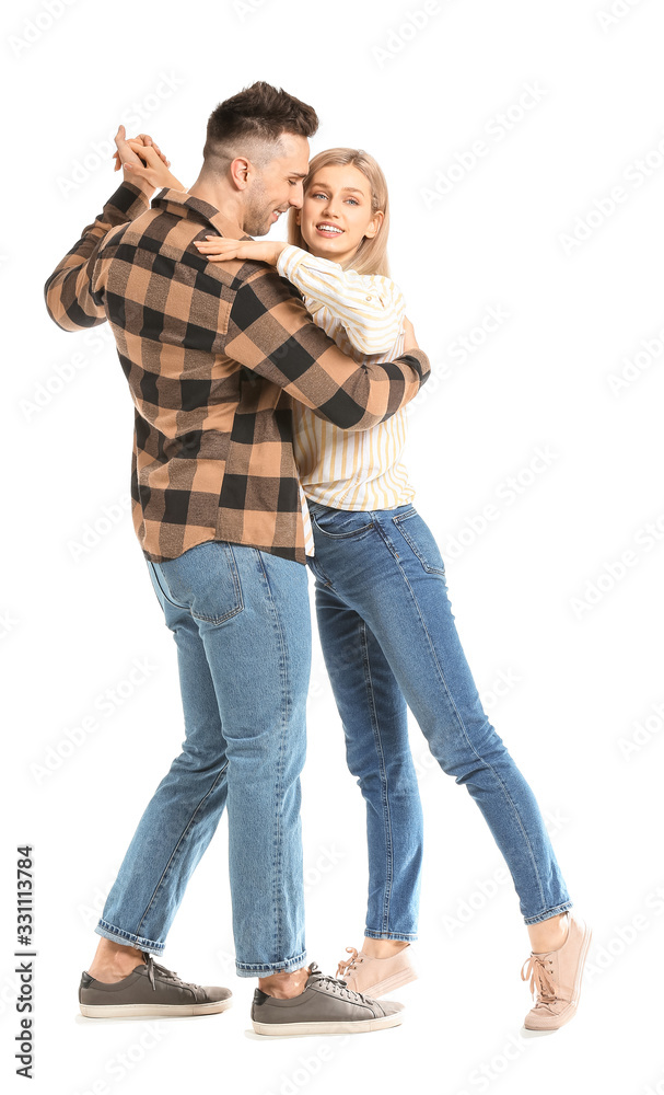 Happy dancing young couple on white background Happy dancing young couple on white background