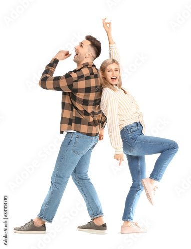 Happy dancing young couple ...