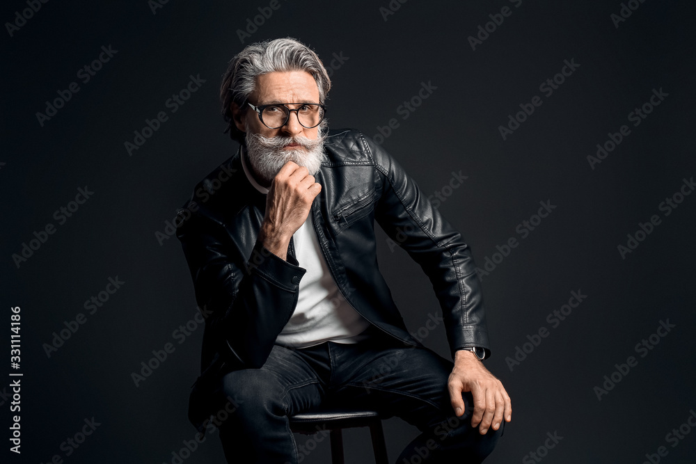 Stylish elderly man on dark background Stylish elderly man on dark background