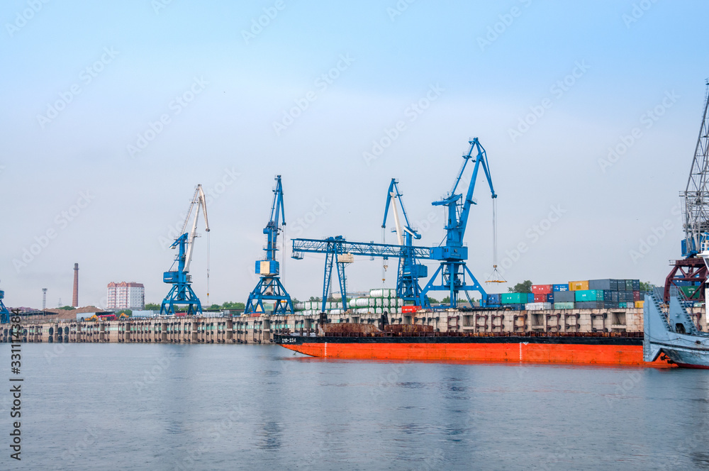 Russia, Blagoveshchensk, July 2019: River station, cranes for loading operations, Blagoveshchensk in summer