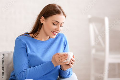 Young woman in warm sweater...