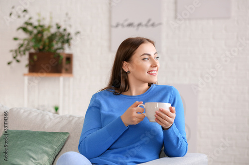 Young woman in warm sweater...