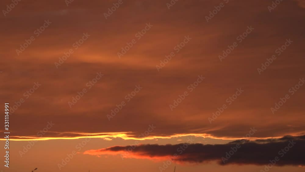 Sunset sky burning orange and red time lapse 4K Sunset sky burning orange and red time lapse 4K