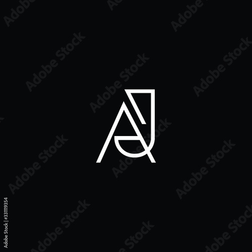 Minimal elegant monogram art logo. Outstanding professional trendy awesome artistic AJ JA initial based Alphabet icon logo. Premium Business logo White color on black background photo