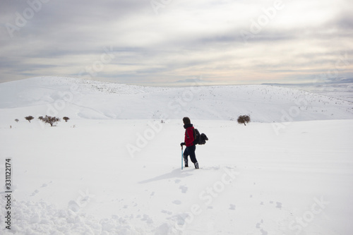 climber man walking in the snow