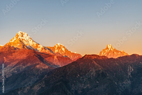 Majestic view of sunset sweeping through Annapurna South and Himchuli from Poon Hill, Ghorepani, Nepal photo
