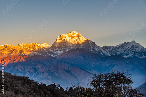 Majestic view of sunset sweeping through Dhaulagiri mountain range from Poon Hill, Ghorepani, Nepal photo