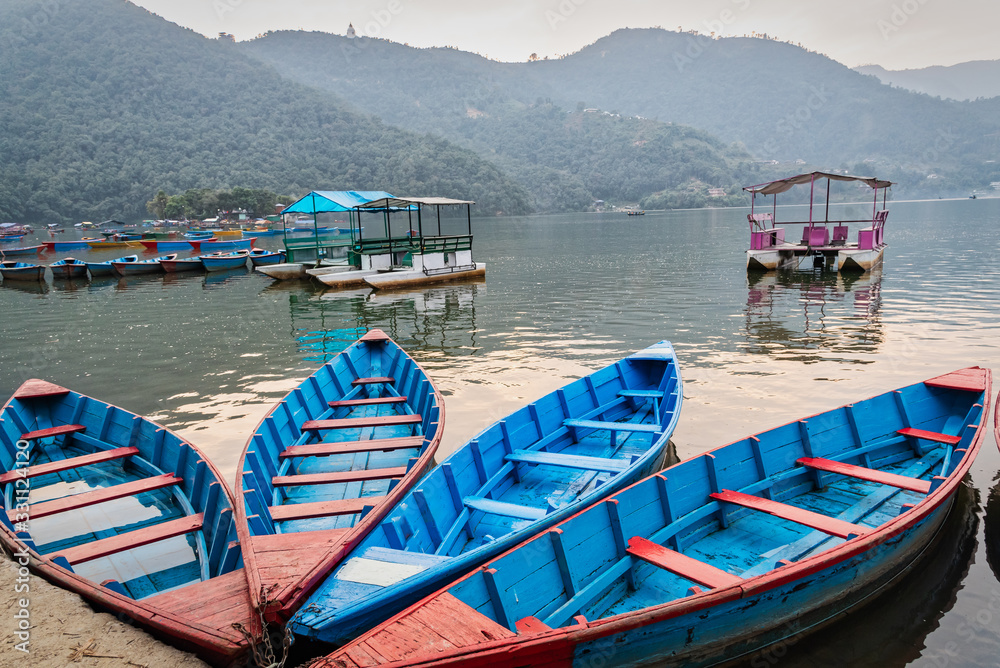 Beautiful view of boats docked at Phewa lake in Pokhara Nepal