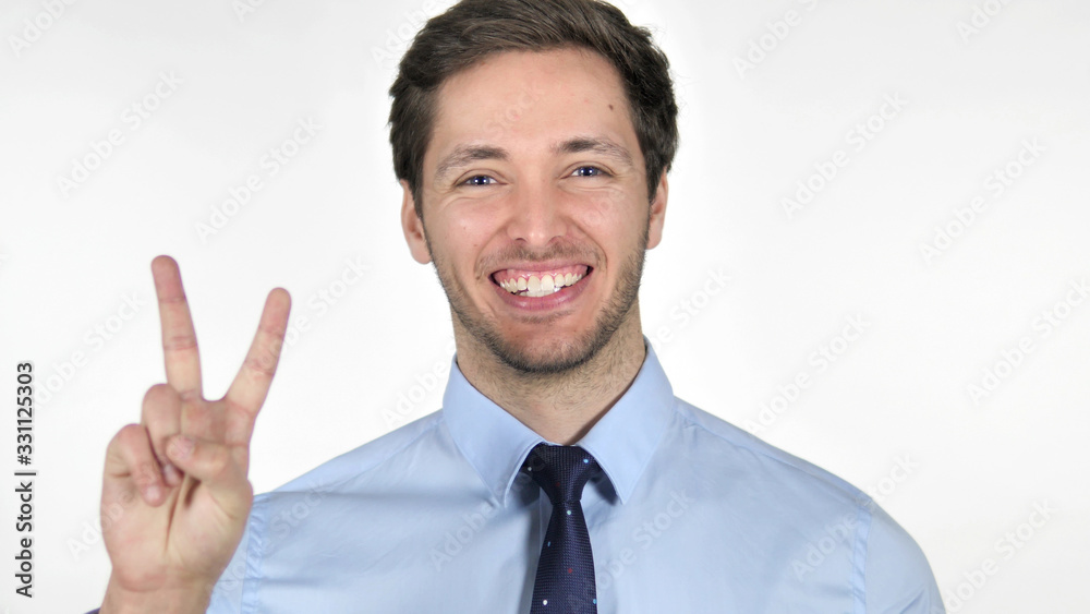 Sign of Victory by Young Businessman on White Background Sign of Victory by Young Businessman on White Background