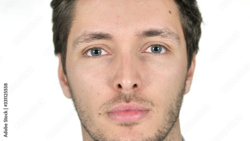 Close Up of Serious Young Man Face, White Background