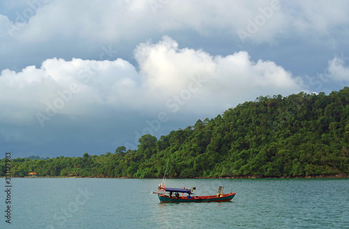 Old fishing boat on the background of the island