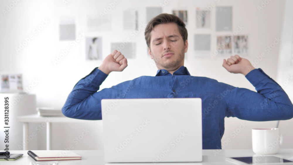 Tired Casual Adult Man Relaxing Body by Stretching Tired Casual Adult Man Relaxing Body by Stretching