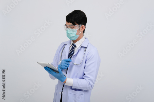 doctor physician practitioner wearing mask with tablet   stethoscope on white background. medical healthcare concept