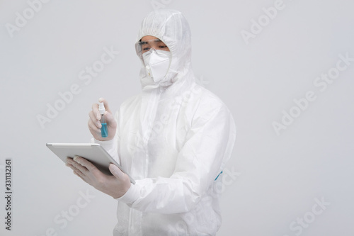 Εκτύπωση καμβά man wearing biological protective uniform suit clothing, mask, gloves spraying s