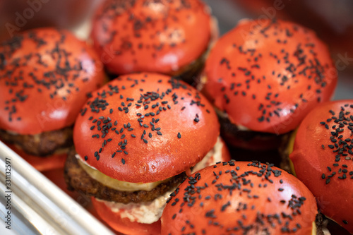 red burgers on a metal tray. buffet for holiday