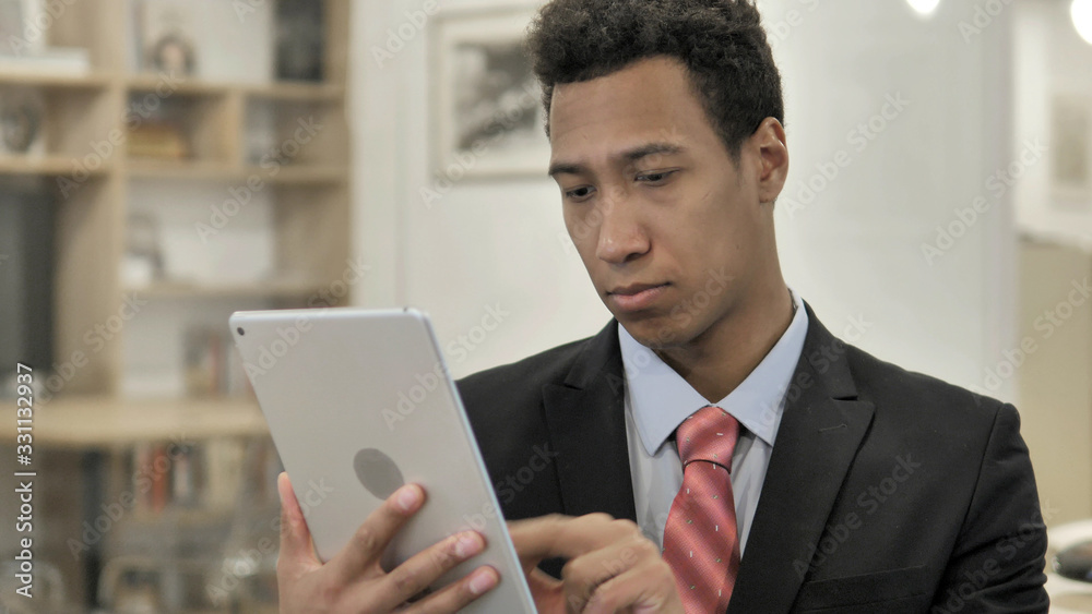 Young African Businessman Using Tablet Young African Businessman Using Tablet