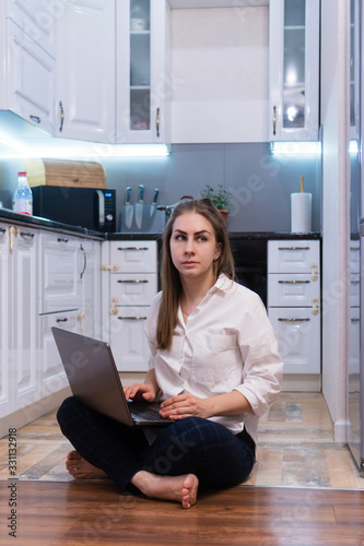 Young business woman sitting and taking notes in notebook. laptop. Student learning online. Student learning language, watching online webinar, listening audio course, e-learning education concept.