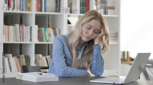 Tired Young Blonde Woman Sleeping at Work, Workload © stockbakers