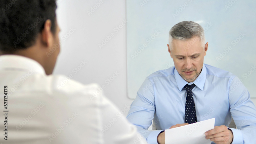 Senior Businessman Discussing Contract with New Employee at Work, Paperwork Senior Businessman Discussing Contract with New Employee at Work, Paperwork