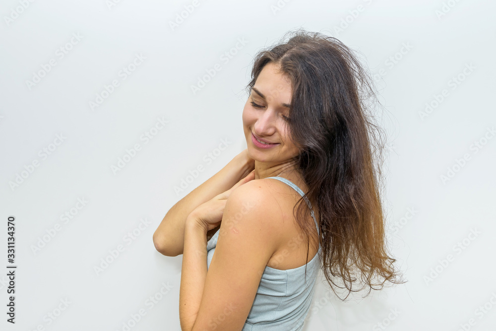 Fashion woman in elegant dress touching her hair. Sensual portrait of attractive woman Fashion woman in elegant dress touching her hair. Sensual portrait of attractive woman