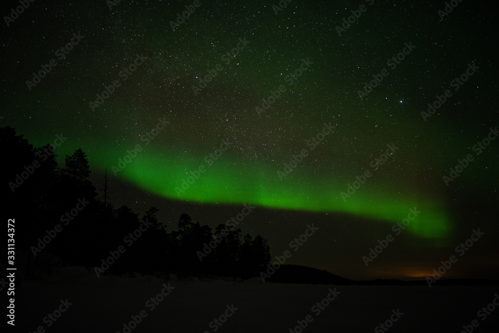 aurora borealis at frozen sea in ivalo, finland.