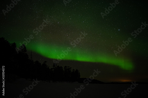 aurora borealis at frozen sea in ivalo  finland.
