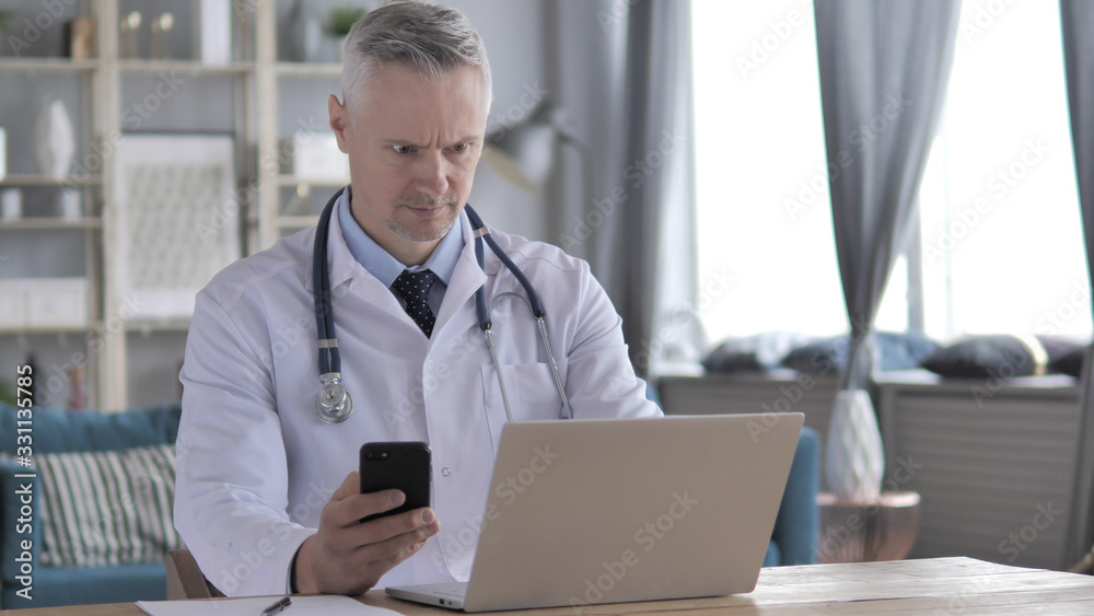 Gray Hair Man Browsing Internet on Tablet while Sitting on Couch