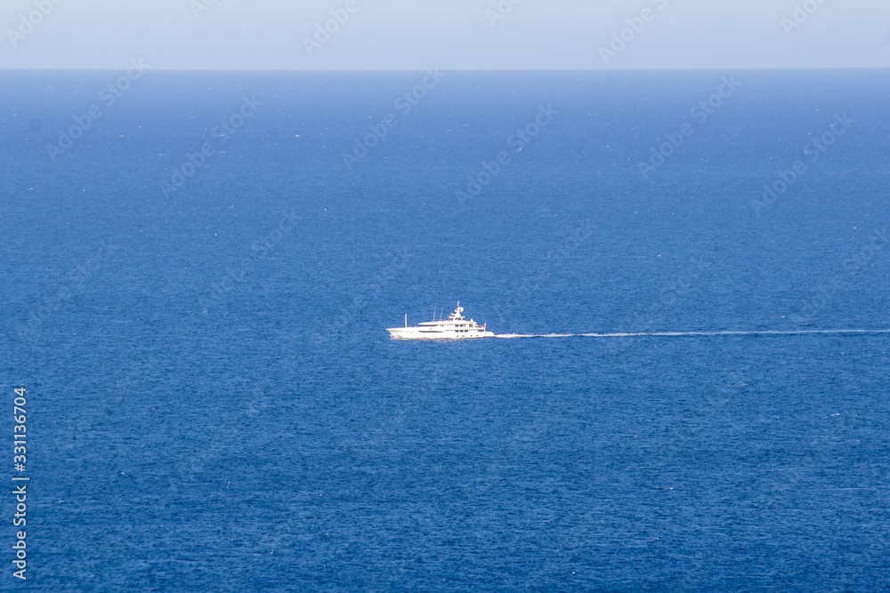 alone yacht on the blue sea