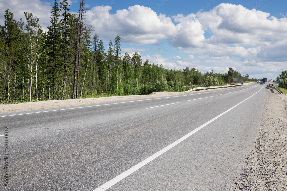 Fototapeta premium Empty highway Surgut-Kogalym in summer.