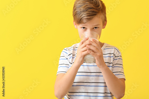 Little boy with milk on col...