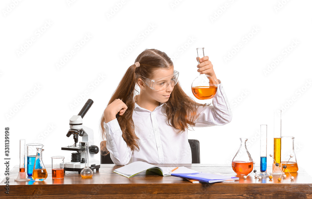Cute little girl studying chemistry at table against white background Stock  Photo | Adobe Stock