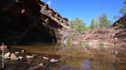 Beautiful colourful of scenic footage surrounding with green trees rocks formation mountain water fall of Fortescue falls karijini national park in the afternoon light, Perth, Western of Australia photo