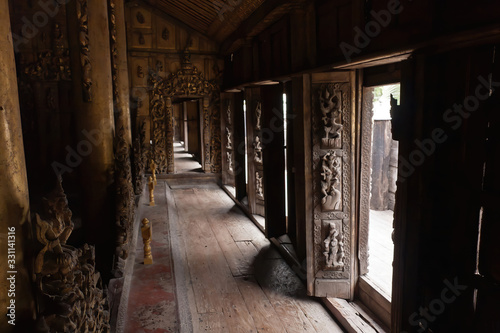 The ornate wooden interior and decoration of Shwenandaw Monastery, Mandalay, Myanmar