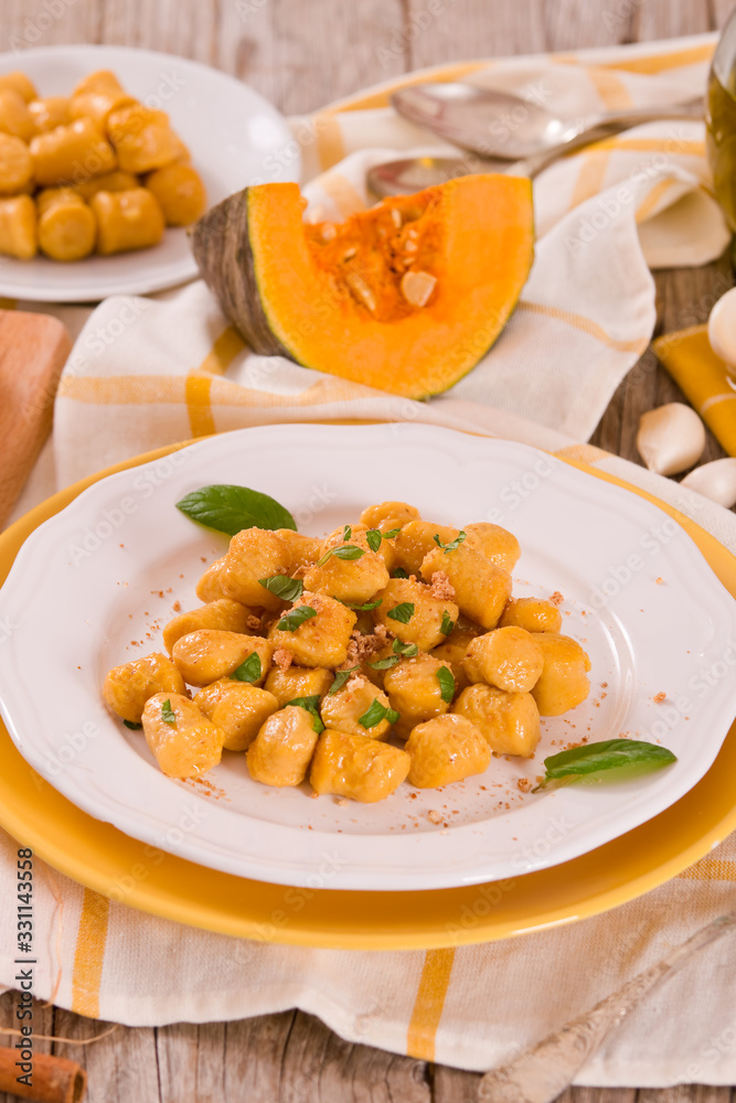 Pumpkin gnocchi with grated amaretti cookies.