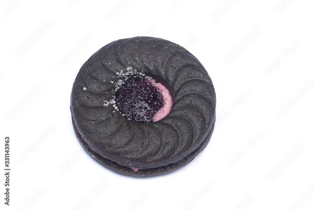 A chocolate cookie with Strawberry jam isolated on white background A chocolate cookie with Strawberry jam isolated on white background