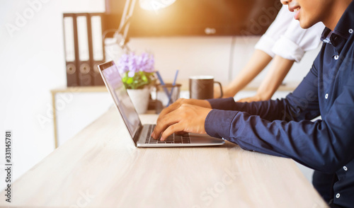 A woman's hand using and touching on laptop touchpad stock photo